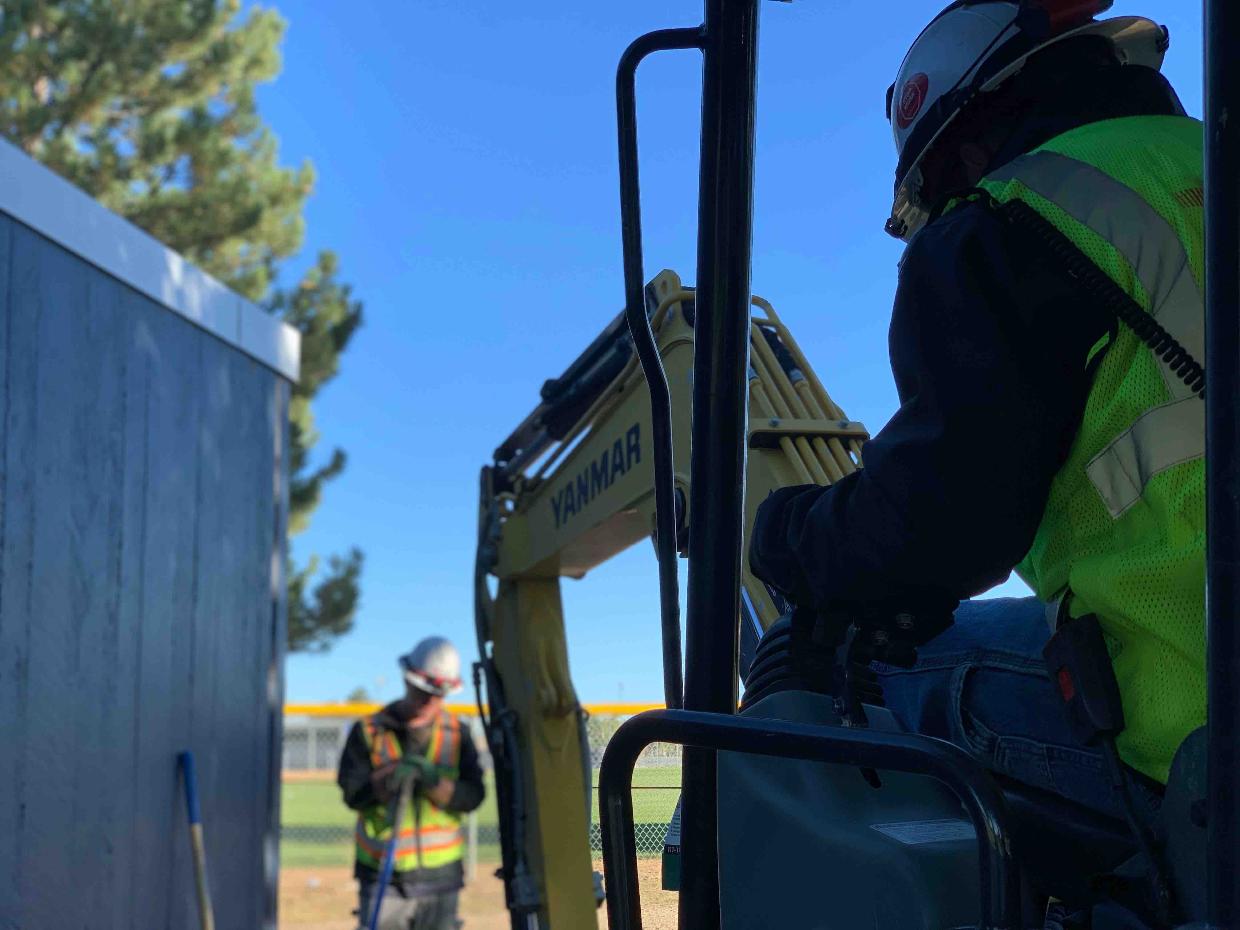 field workers digging into pipes